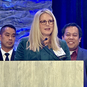 a photo of Amber R. Van Til, IBA president & CEO, accepting the 2023 Association Executive of the Year award